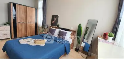 Stylish bedroom with modern decor and ample natural light