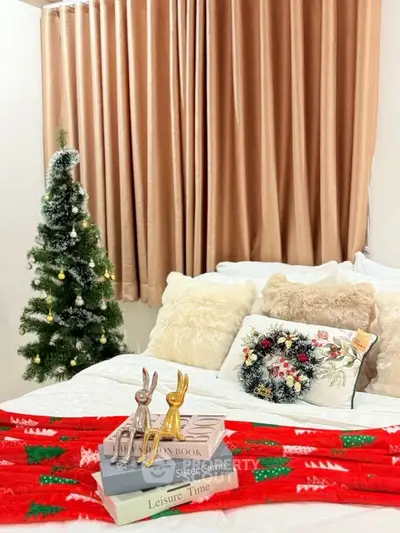 Cozy bedroom with festive decor and plush pillows, perfect for holiday relaxation.