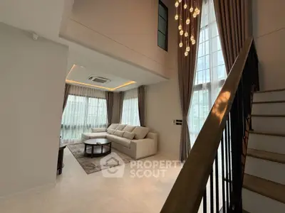 Luxurious modern living room with high ceilings and elegant lighting