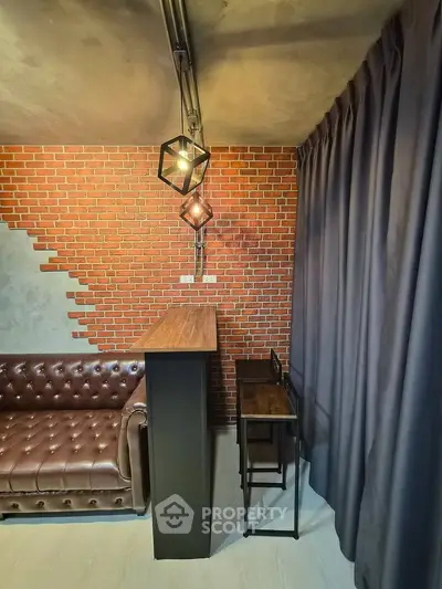 Stylish industrial living room with exposed brick wall and modern lighting