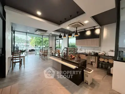 Spacious modern kitchen with open layout and stylish lighting