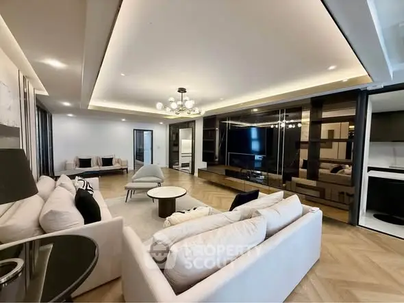 Luxurious modern living room with elegant lighting and spacious seating area, perfect for relaxation and entertainment.