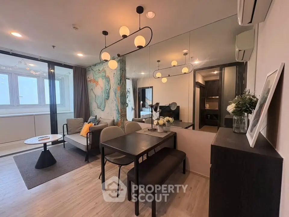 Modern living room with stylish dining area and elegant lighting fixtures