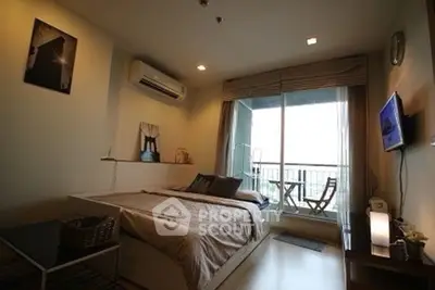 Cozy bedroom with balcony access and modern decor