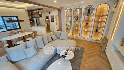 Luxurious living room with modern decor and open kitchen layout