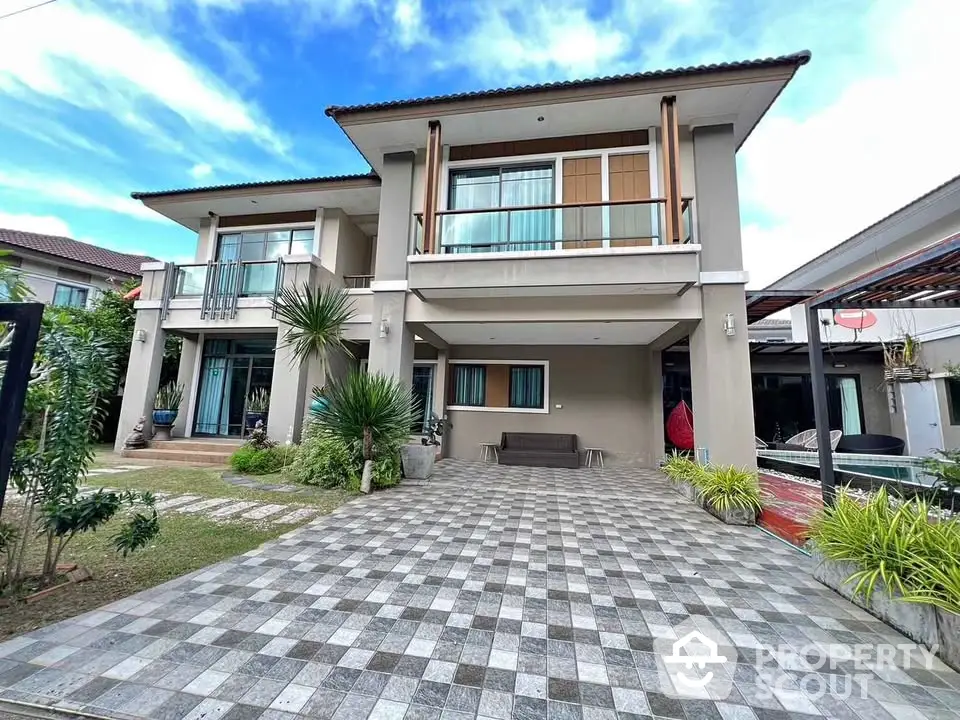 Stunning modern two-story house with spacious driveway and lush landscaping