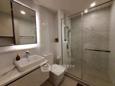 Modern bathroom with sleek design and glass shower enclosure