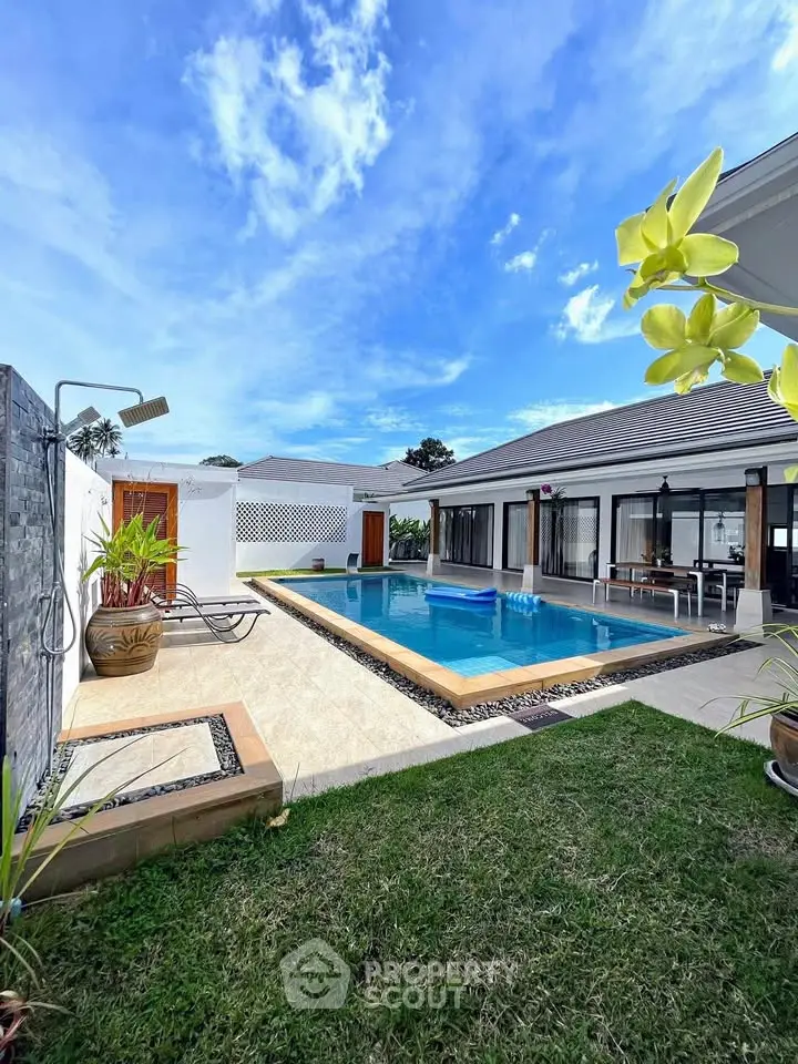 Luxurious villa with private pool and lush garden, perfect for relaxation and entertainment.