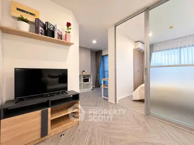 Modern living room with sleek design and open layout, featuring stylish furniture and natural light.