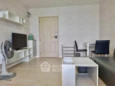 Modern living room with stylish brick wall, sleek furniture, and cozy ambiance.