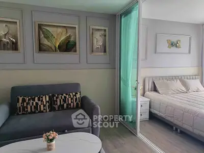 Modern living room with stylish decor and cozy bedroom view