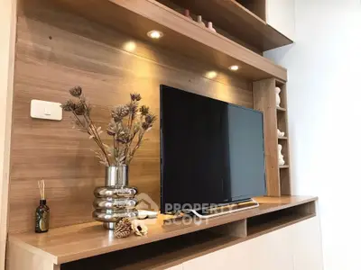 Modern living room with sleek wooden TV unit and elegant decor