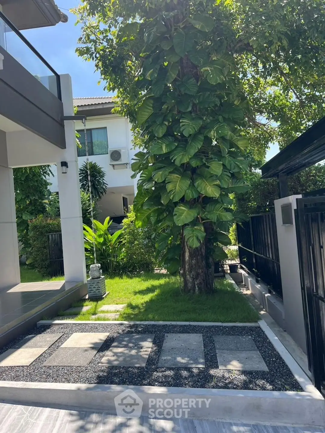 Charming garden view of modern home with lush greenery and stylish exterior design.