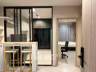 Modern apartment interior with open kitchen and cozy bedroom view