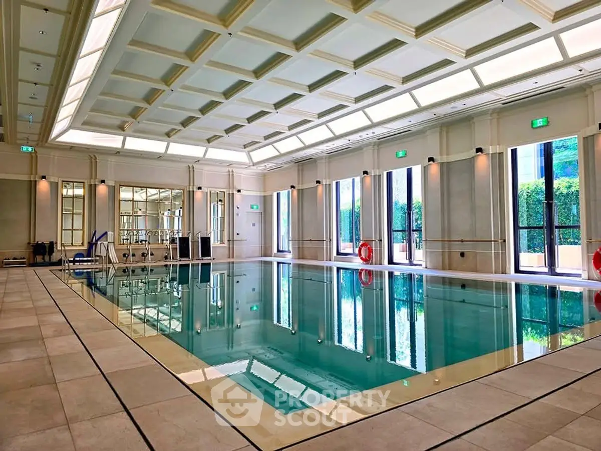 Luxurious indoor swimming pool with elegant design and natural lighting