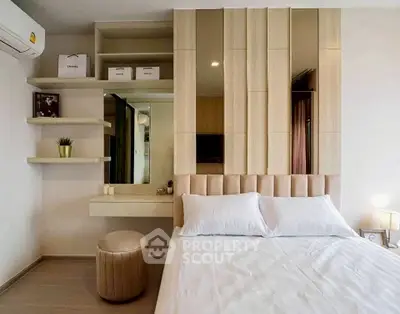 Modern bedroom with stylish decor and cozy ambiance, featuring a plush bed and elegant shelving.