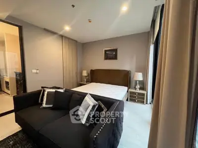 Modern bedroom with stylish decor and cozy ambiance in a contemporary apartment.