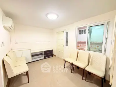 Bright and cozy living room with modern furniture and ample natural light.