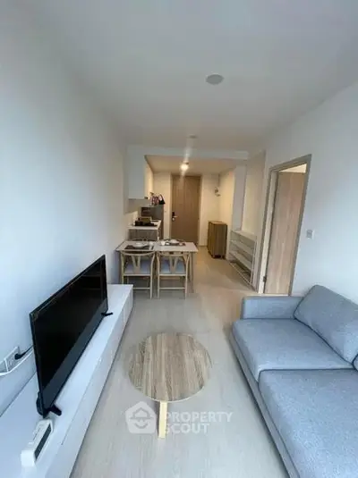 Modern living room with sleek furniture and open layout, perfect for cozy gatherings.