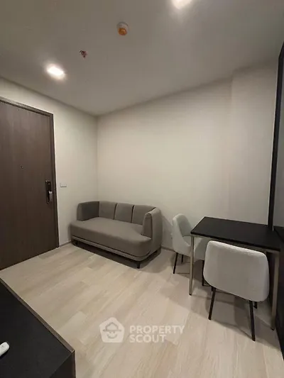 Modern living room with minimalist decor and cozy seating area