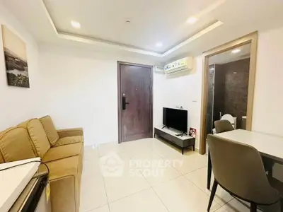 Modern living room with cozy seating and sleek TV setup