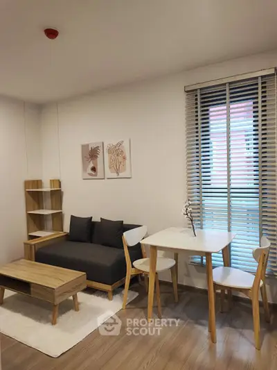 Modern living room with stylish furniture and natural light, perfect for cozy gatherings.