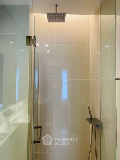 Modern bathroom with glass shower and sleek fixtures