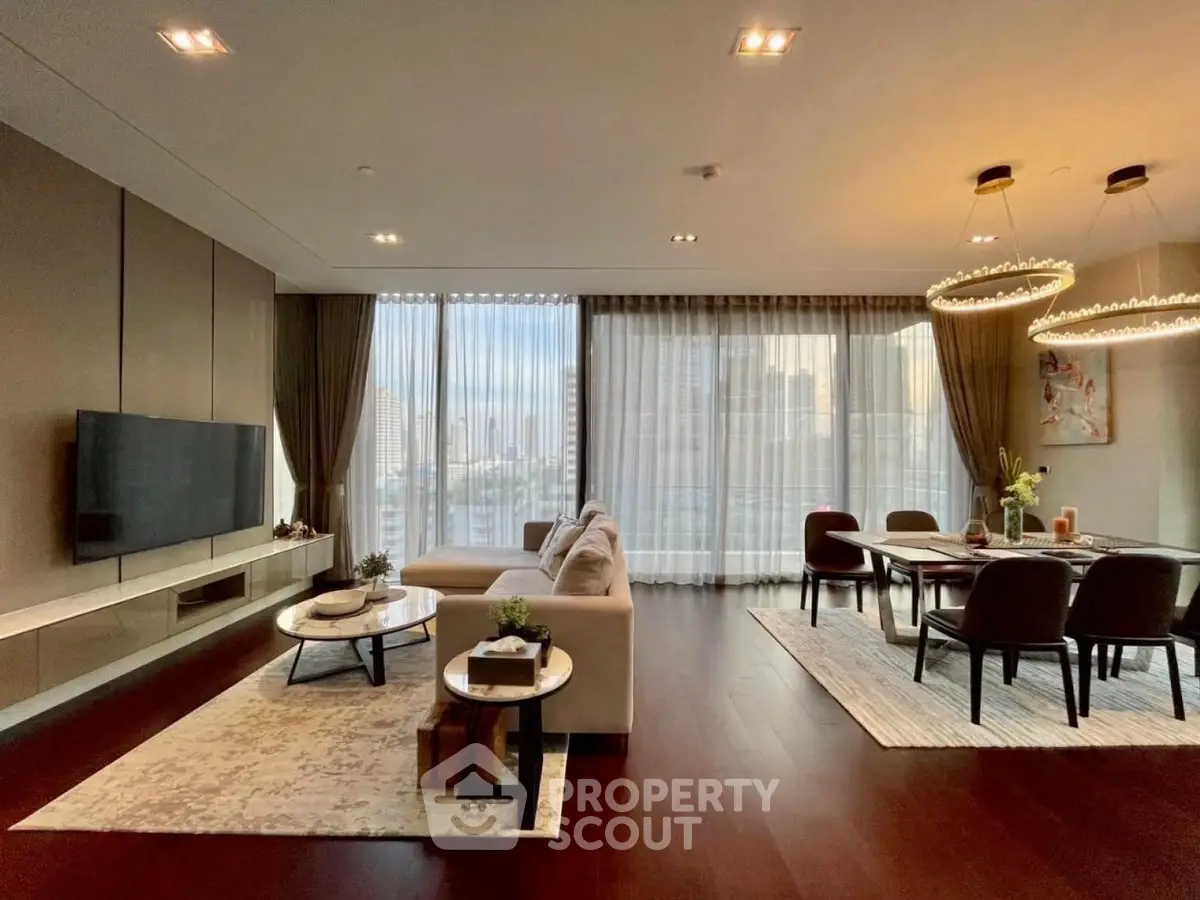Luxurious modern living room with elegant dining area and city view, featuring stylish lighting and decor.