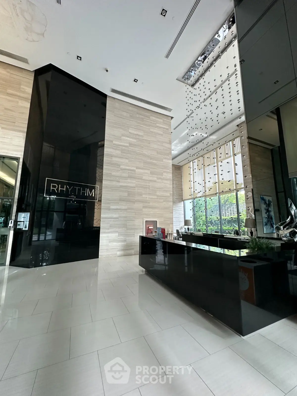Luxurious modern building entrance with sleek design and high ceilings