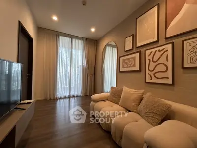 Cozy living room with modern decor and large windows for natural light.