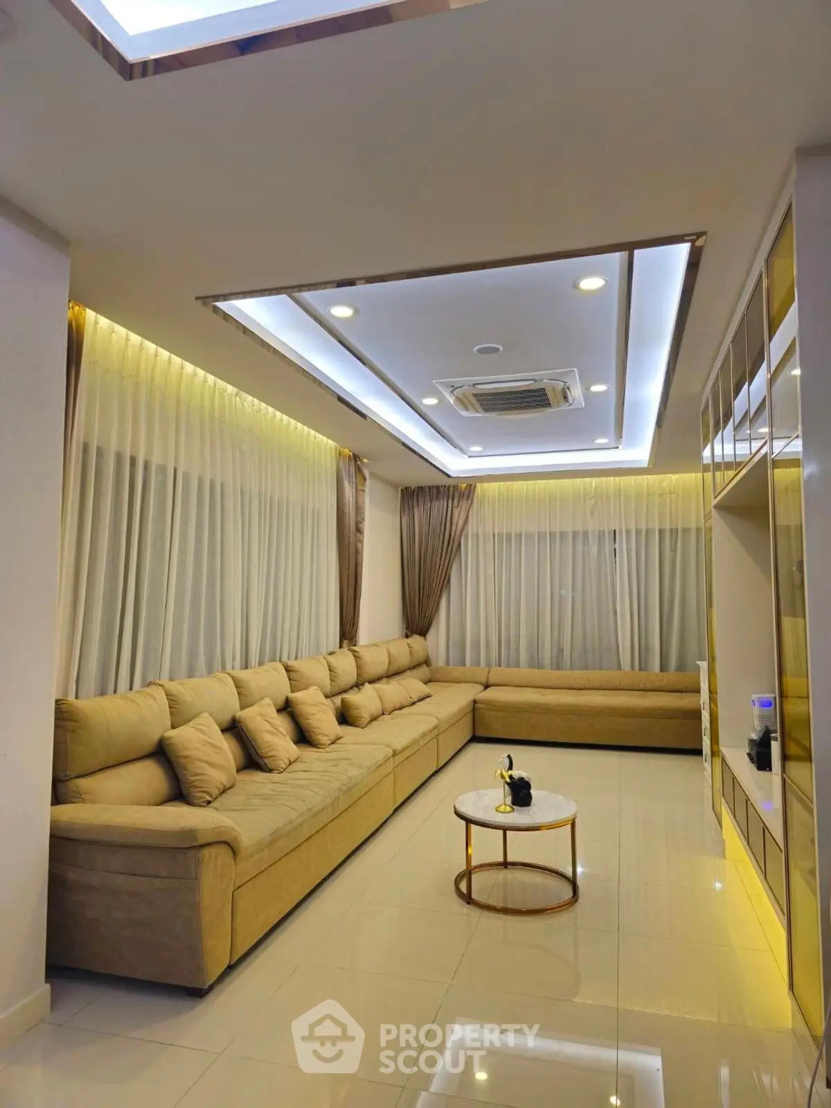 Luxurious living room with elegant lighting and spacious seating area