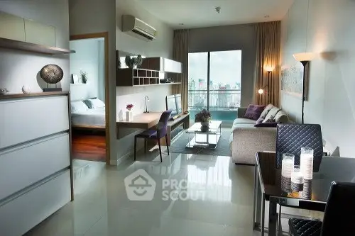 Modern living room with sleek design and city view, featuring a cozy bedroom and stylish furniture.