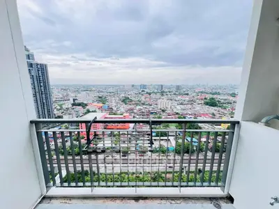 Stunning high-rise balcony view overlooking cityscape with expansive skyline.