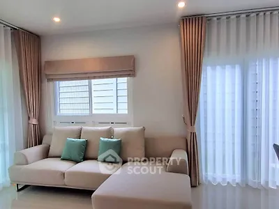 Elegant living room with cozy beige sofa and stylish curtains