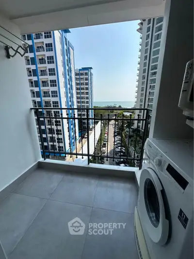 Modern apartment balcony with washing machine and stunning city view