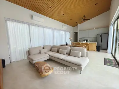 Spacious modern living room with open kitchen and elegant decor