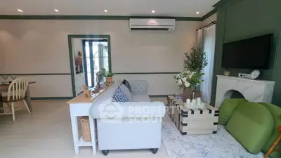 Charming living room with elegant decor and cozy seating area, perfect for relaxation.
