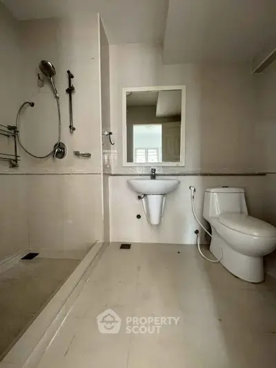 Spacious modern bathroom with shower and toilet in minimalist design