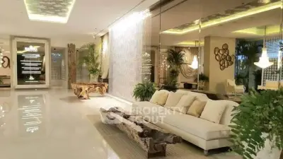 Luxurious living room with elegant decor and plush seating in a modern real estate property.
