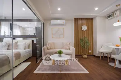 Modern studio apartment with cozy living area and stylish decor