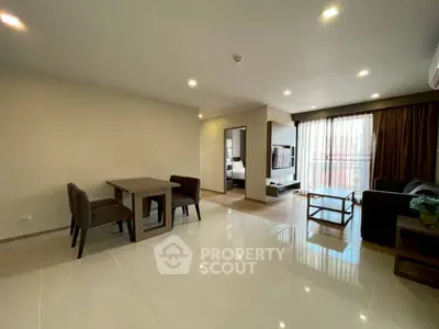 Spacious modern living room with dining area and natural light