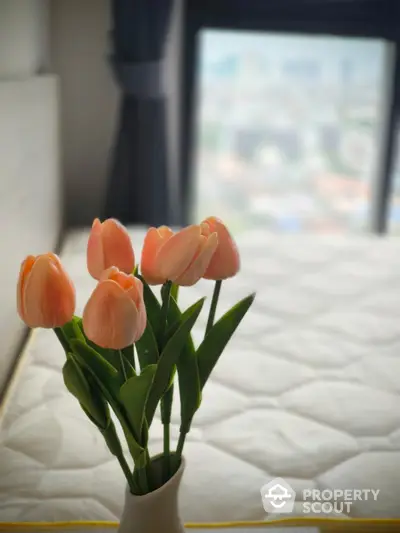 Cozy bedroom with tulip decor and soft natural light