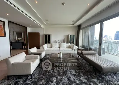 Luxurious modern living room with panoramic city view and elegant furnishings.