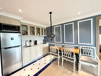 Chic modern kitchen with elegant dining area and stylish lighting
