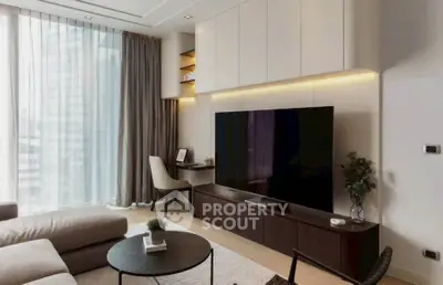 Modern living room with large TV, stylish furniture, and floor-to-ceiling windows.