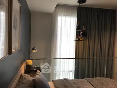 Modern bedroom with stylish lighting and cozy decor, perfect for relaxation.