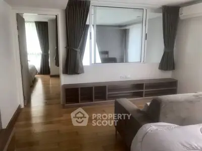 Spacious living area with wooden flooring and modern decor