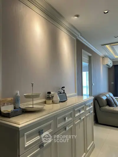 Elegant living room with stylish cabinetry and cozy seating area