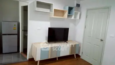 Modern living room with stylish TV stand and wall-mounted shelves