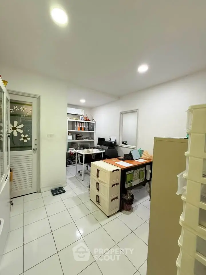 Spacious home office with modern decor and ample storage space